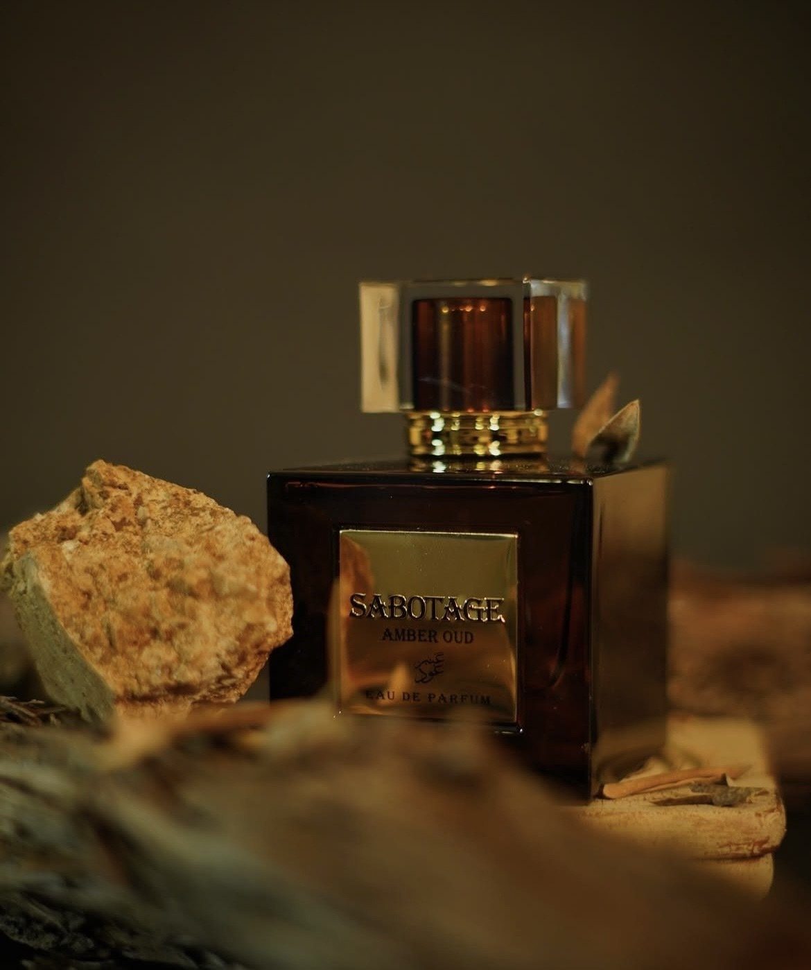 Sabotage Oud beside raw amber