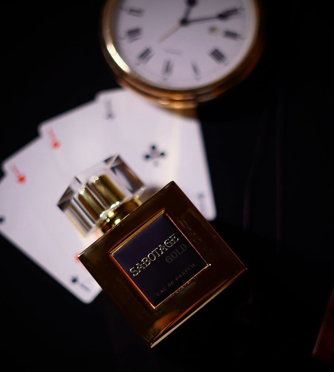 Sabotage Gold with playing cards and a pocket watch